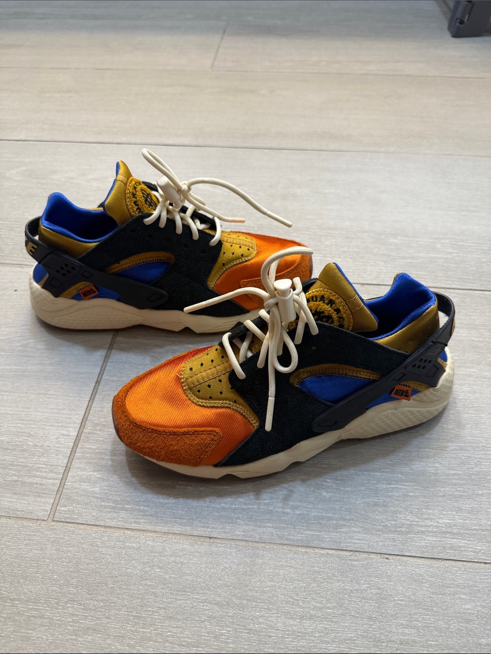 Nike Women’s Orange, Blue & Black Huarache Sneakers